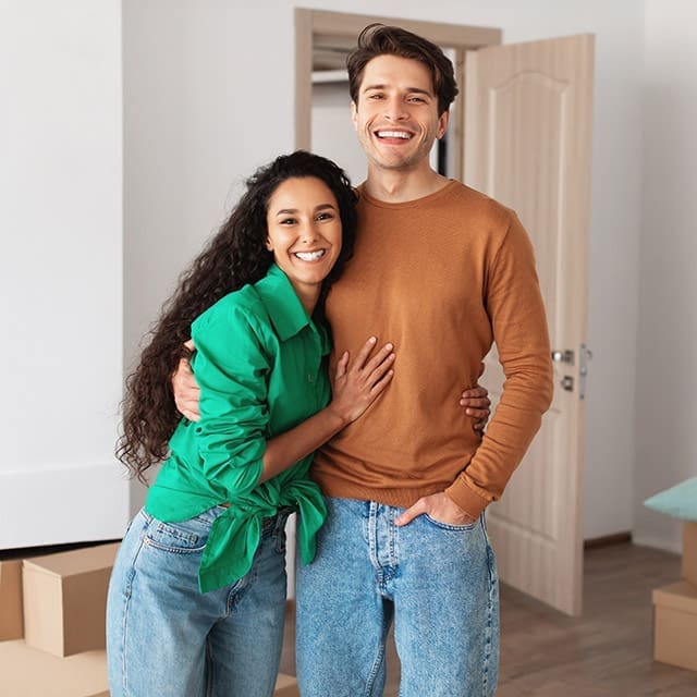Young couple happy in new home after getting a home loan