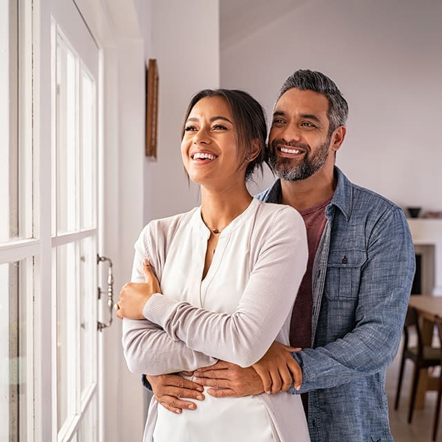 Couple happy after refinancing their home loan