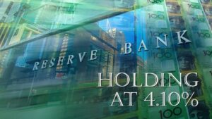 Reserve Bank of Australia signage with reflection and text: Holding at 4.10%