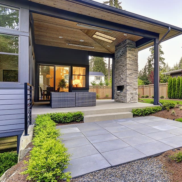 Renovated home with outdoor fireplace and large yard