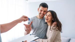Couple with keys for new home