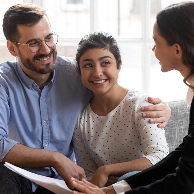 Couple discussing loans with their broker